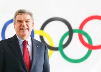 A photo of Thomas Bach, the current president of the International Olympic Committee, with the Olympic rings. (Photography: ASSOCIATION OF NATIONAL OLYMPIC COMMITTEES OF AFRICA)